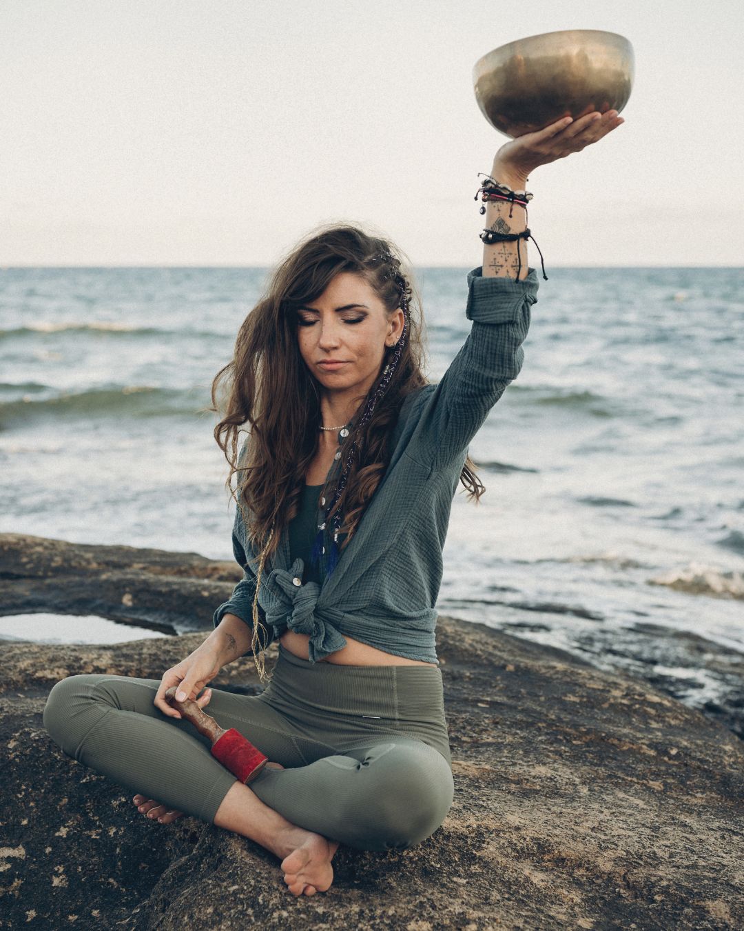 DANIELLE 2 Danielle by the sea holding a singing bowl